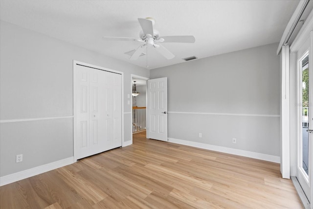4439 Reeves Rd, New Port Richey, FL 34652 - unfurnished bedroom with light wood-style flooring, a closet, and ceiling fan