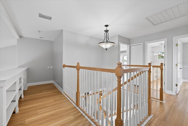 4439 Reeves Rd, New Port Richey, FL 34652 - corridor with an upstairs landing and light wood-type flooring