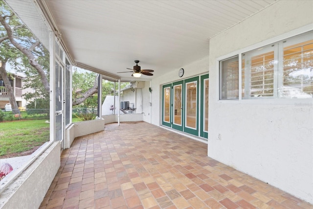 4439 Reeves Rd, New Port Richey, FL 34652 - unfurnished sunroom with a ceiling fan and french doors