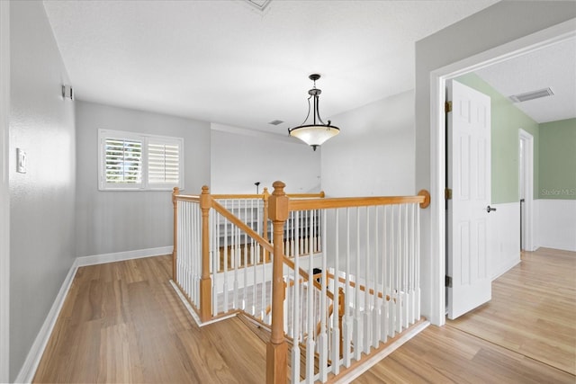 4439 Reeves Rd, New Port Richey, FL 34652 - corridor with an upstairs landing and wood finished floors