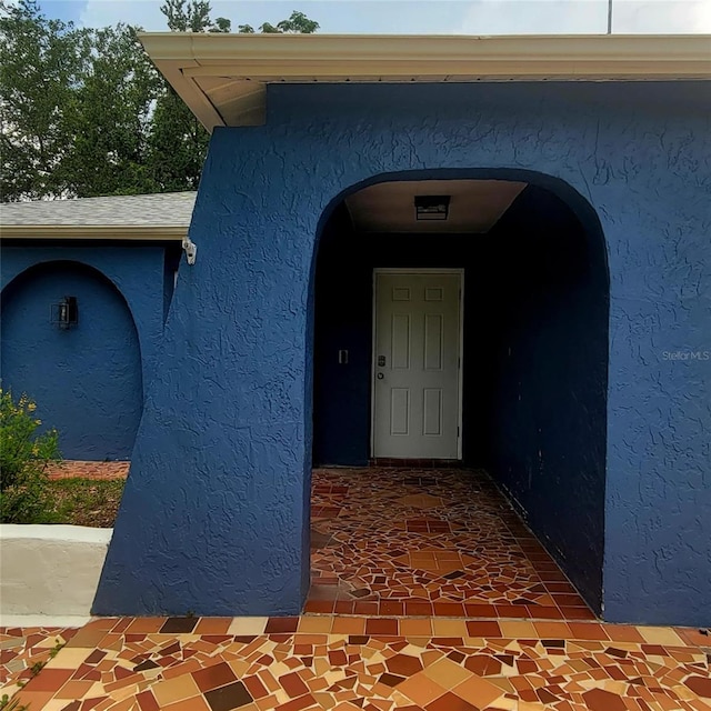 8504 Lafitte Dr, Hudson, FL 34667 - doorway to property featuring stucco siding