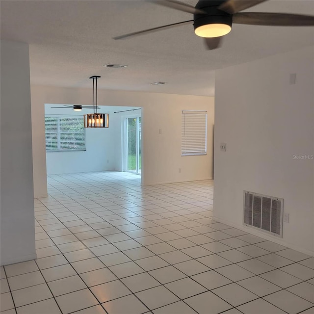 8504 Lafitte Dr, Hudson, FL 34667 - empty room featuring ceiling fan and light tile patterned floors