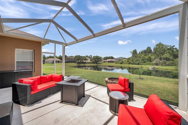 9309 Edistro Pl, New Port Richey, FL 34654 - view of patio / terrace with a water view, an outdoor living space with a fire pit, and glass enclosure