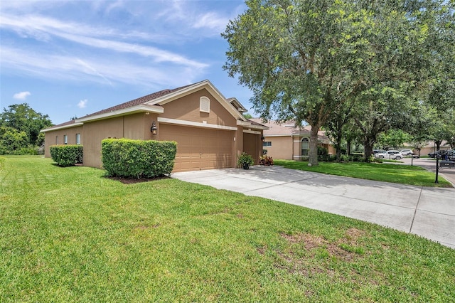 9309 Edistro Pl, New Port Richey, FL 34654 - ranch-style home with stucco siding, concrete driveway, an attached garage, and a front yard