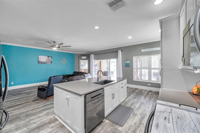 9309 Edistro Pl, New Port Richey, FL 34654 - kitchen with dishwasher, crown molding, light wood-style flooring, ceiling fan, and white cabinets