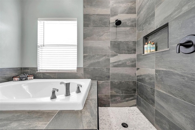 9309 Edistro Pl, New Port Richey, FL 34654 - bathroom featuring a bath and a tile shower