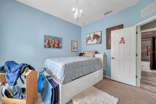 9309 Edistro Pl, New Port Richey, FL 34654 - carpeted bedroom featuring a chandelier