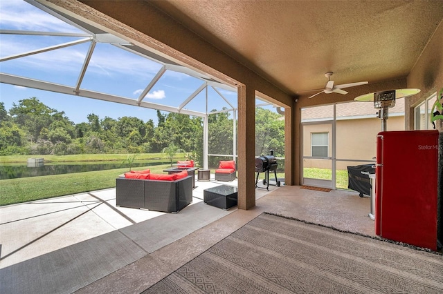 9309 Edistro Pl, New Port Richey, FL 34654 - sunroom featuring an outdoor hangout area, a water view, ceiling fan, and view of scattered trees
