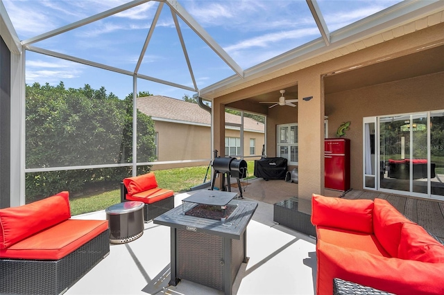 9309 Edistro Pl, New Port Richey, FL 34654 - view of patio / terrace with an outdoor living space with a fire pit, glass enclosure, and a ceiling fan