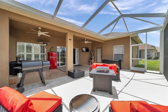 9309 Edistro Pl, New Port Richey, FL 34654 - view of patio / terrace featuring a ceiling fan, a lanai, and an outdoor living space with a fire pit