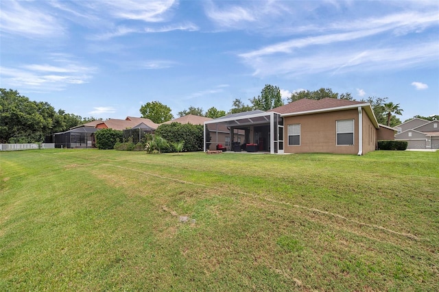 9309 Edistro Pl, New Port Richey, FL 34654 - view of grassy yard with glass enclosure
