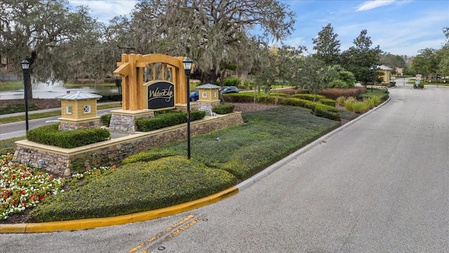 9309 Edistro Pl, New Port Richey, FL 34654 - community sign featuring view of wooded area
