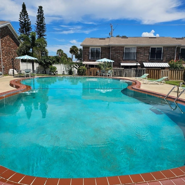 2200 S Palmetto Ave Unit E050, South Daytona, FL 32119 - community pool featuring a patio area