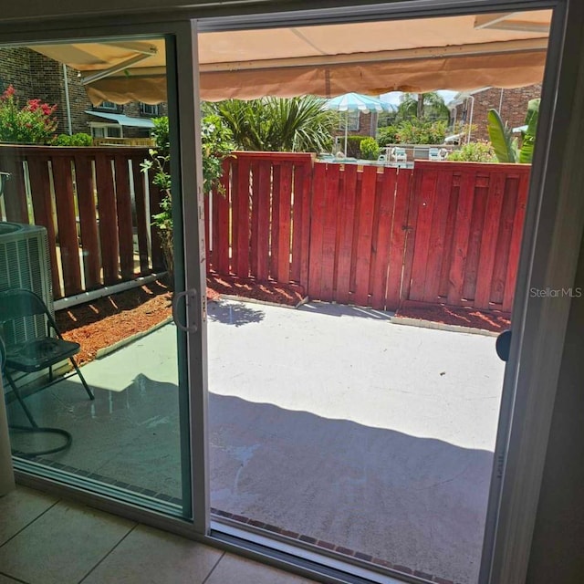 2200 S Palmetto Ave Unit E050, South Daytona, FL 32119 - doorway to outside featuring tile patterned floors