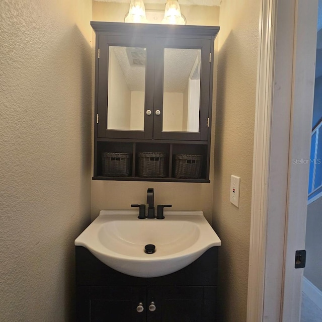 2200 S Palmetto Ave Unit E050, South Daytona, FL 32119 - bathroom with vanity and a textured wall