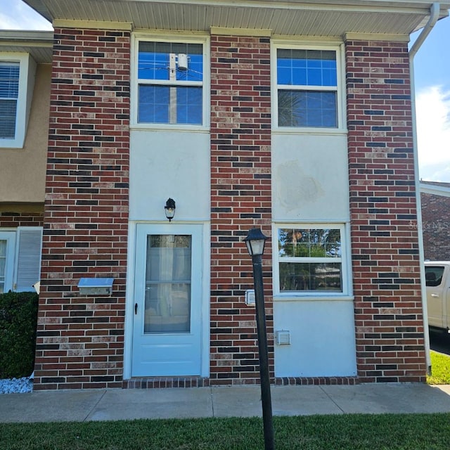 2200 S Palmetto Ave Unit E050, South Daytona, FL 32119 - doorway to property featuring brick siding