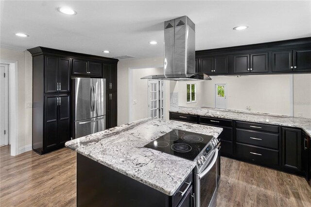 2202 Amity Ct, New Port Richey, FL 34655 - kitchen featuring stainless steel appliances, island exhaust hood, dark cabinetry, light stone counters, and recessed lighting