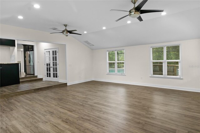 2202 Amity Ct, New Port Richey, FL 34655 - unfurnished living room with ceiling fan, lofted ceiling, dark wood finished floors, and recessed lighting