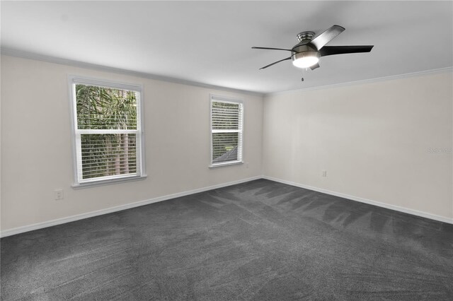 2202 Amity Ct, New Port Richey, FL 34655 - spare room featuring ornamental molding, dark colored carpet, a ceiling fan, and plenty of natural light