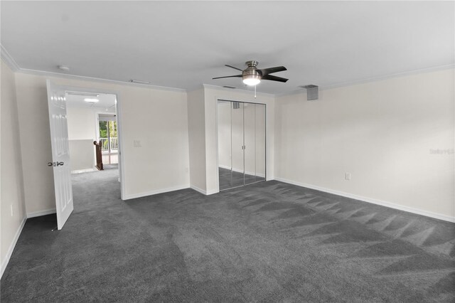 2202 Amity Ct, New Port Richey, FL 34655 - unfurnished bedroom with crown molding, dark carpet, a closet, and ceiling fan