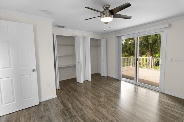 2202 Amity Ct, New Port Richey, FL 34655 - unfurnished bedroom featuring access to exterior, multiple closets, dark wood-style flooring, crown molding, and ceiling fan