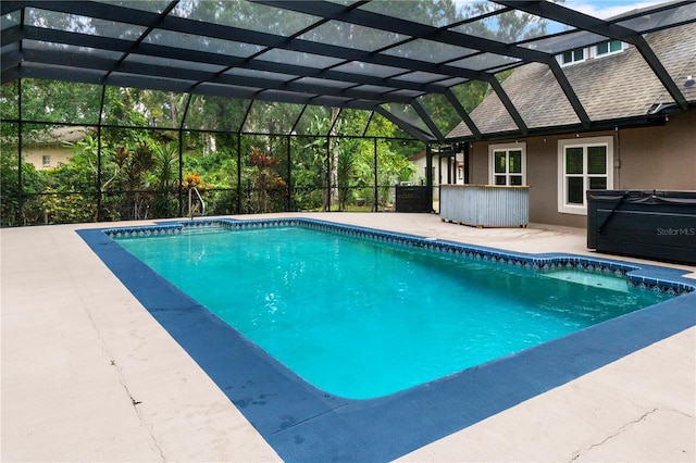 2202 Amity Ct, New Port Richey, FL 34655 - swimming pool with a patio area and glass enclosure
