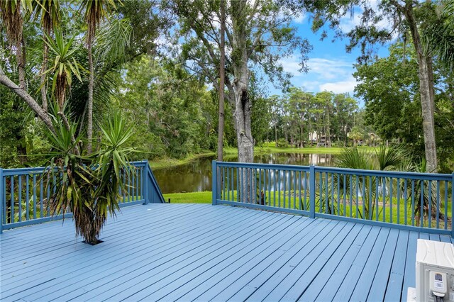 2202 Amity Ct, New Port Richey, FL 34655 - wooden terrace featuring a water view and view of wooded area