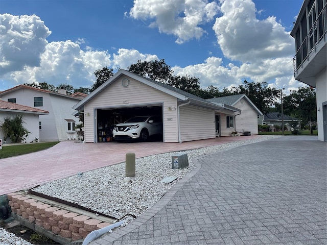 20971 Negril Ct, Lutz, FL 33558 - view of property exterior with decorative driveway and a garage