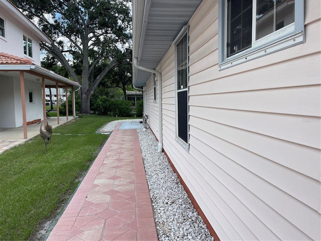 20971 Negril Ct, Lutz, FL 33558 - view of grassy yard featuring a patio area