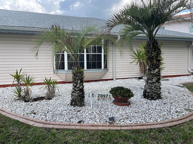 20971 Negril Ct, Lutz, FL 33558 - view of property exterior with roof with shingles