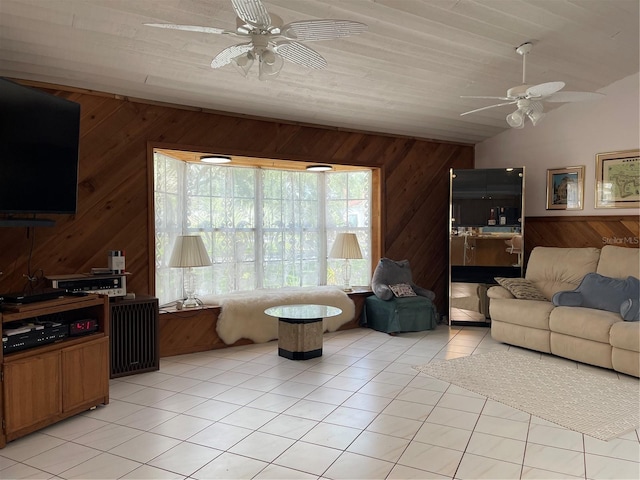 20971 Negril Ct, Lutz, FL 33558 - living room with ceiling fan, wooden walls, light tile patterned floors, and lofted ceiling