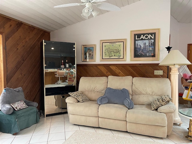 20971 Negril Ct, Lutz, FL 33558 - tiled living area featuring lofted ceiling, wooden walls, ceiling fan, and a wainscoted wall