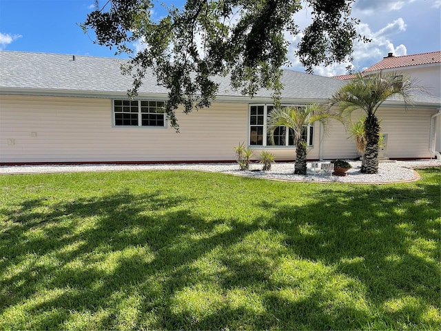 20971 Negril Ct, Lutz, FL 33558 - back of property with a yard and a shingled roof