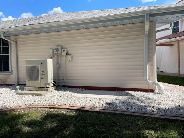 20971 Negril Ct, Lutz, FL 33558 - doorway to property with roof with shingles