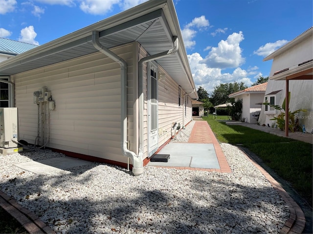 20971 Negril Ct, Lutz, FL 33558 - view of property exterior with a patio and a cooling unit