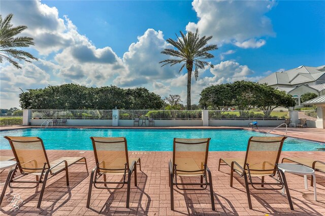 9406 Burnam Dr, Weeki Wachee, FL 34613 - community pool with a patio area