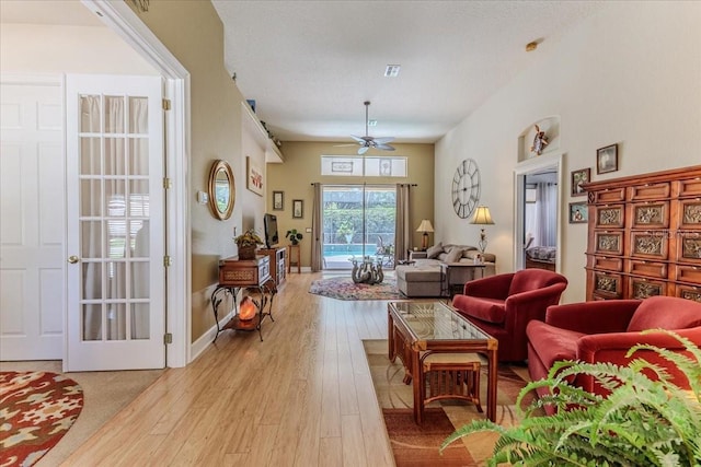 9406 Burnam Dr, Weeki Wachee, FL 34613 - living room with ceiling fan and light wood-type flooring