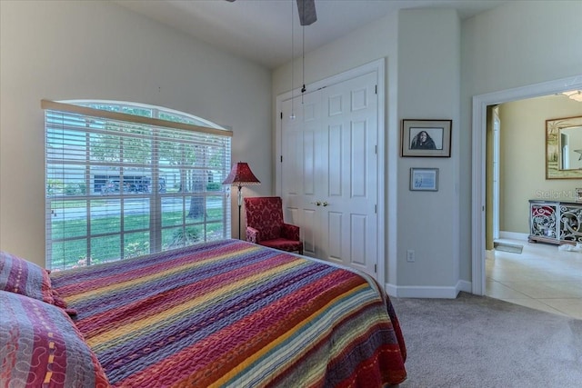 9406 Burnam Dr, Weeki Wachee, FL 34613 - bedroom with carpet flooring, ceiling fan, and tile patterned floors