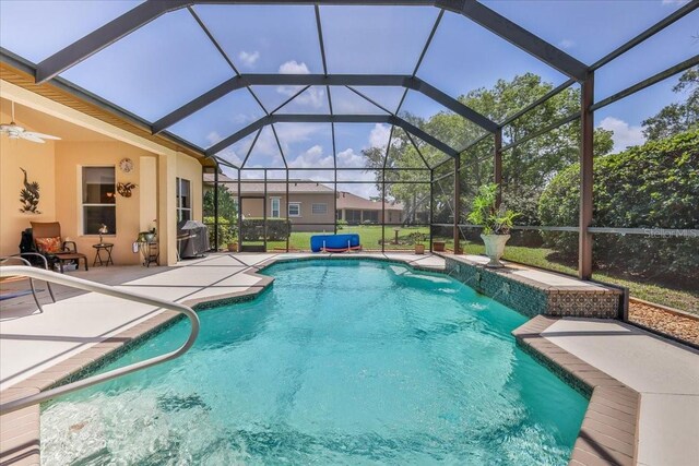 9406 Burnam Dr, Weeki Wachee, FL 34613 - swimming pool featuring a patio, a grill, and ceiling fan