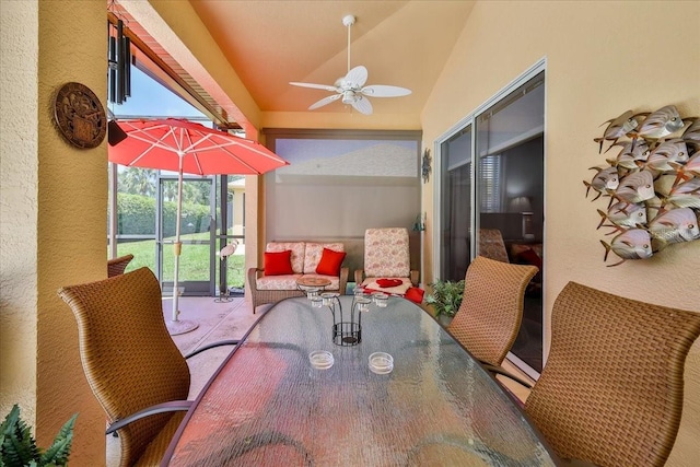 9406 Burnam Dr, Weeki Wachee, FL 34613 - sunroom / solarium featuring a ceiling fan, outdoor dining space, and lofted ceiling