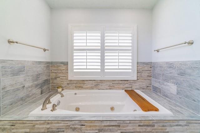 10060 Chip Ln, New Port Richey, FL 34654 - full bath with a tub with jets and plenty of natural light