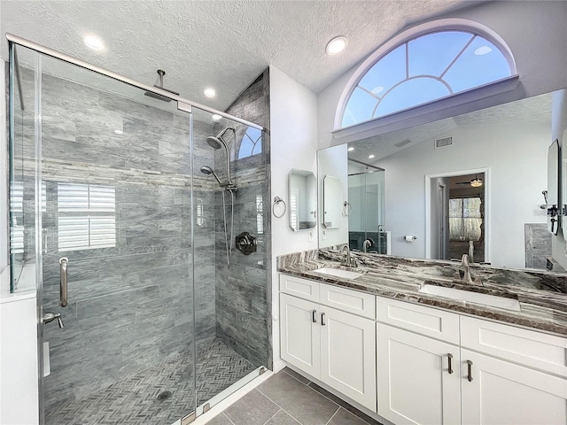10060 Chip Ln, New Port Richey, FL 34654 - full bathroom featuring a shower stall, double vanity, recessed lighting, plenty of natural light, and vaulted ceiling