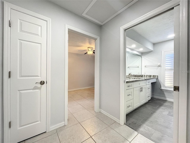 10060 Chip Ln, New Port Richey, FL 34654 - bathroom featuring vanity, tile patterned flooring, and a textured ceiling
