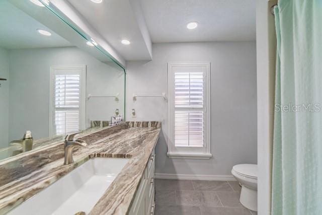 10060 Chip Ln, New Port Richey, FL 34654 - bathroom with double vanity, tile patterned flooring, and recessed lighting