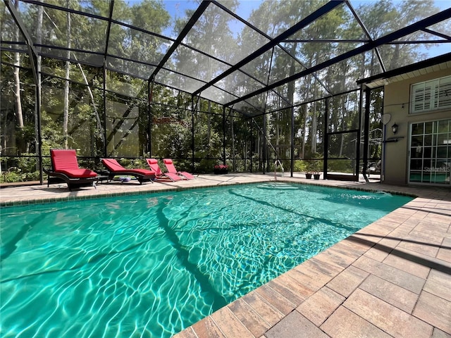 10060 Chip Ln, New Port Richey, FL 34654 - outdoor pool featuring a patio and a lanai