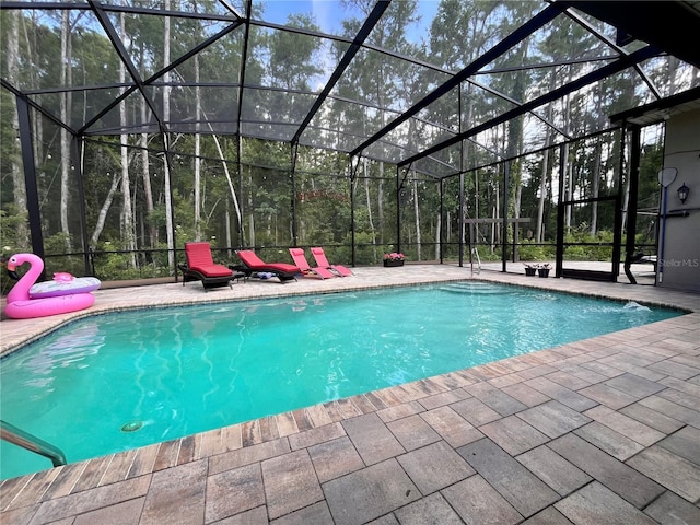 10060 Chip Ln, New Port Richey, FL 34654 - outdoor pool featuring a patio and a lanai