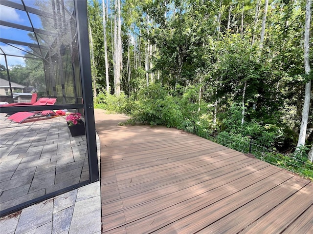 10060 Chip Ln, New Port Richey, FL 34654 - wooden terrace featuring glass enclosure and a patio