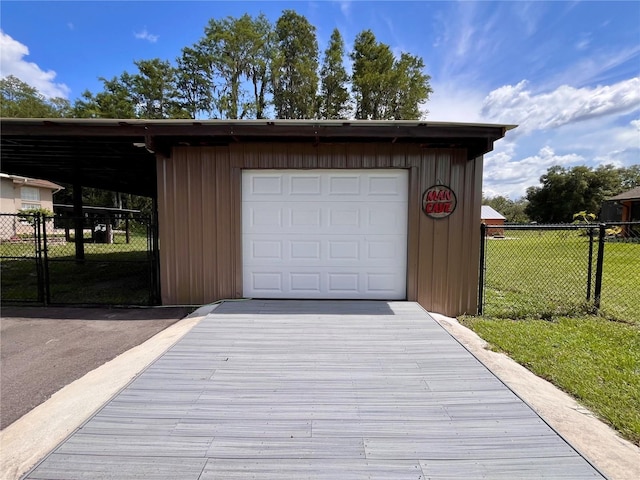 10060 Chip Ln, New Port Richey, FL 34654 - garage with driveway and a detached garage