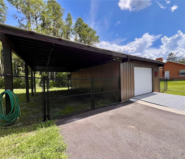 10060 Chip Ln, New Port Richey, FL 34654 - garage with asphalt driveway and a detached garage