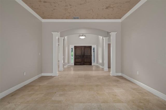 7268 Crystal Spring Run, Weeki Wachee, FL 34607 - entryway with arched walkways, crown molding, and ornate columns